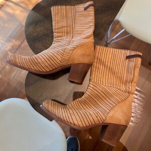 Humanoid tan leather boots with black stripes